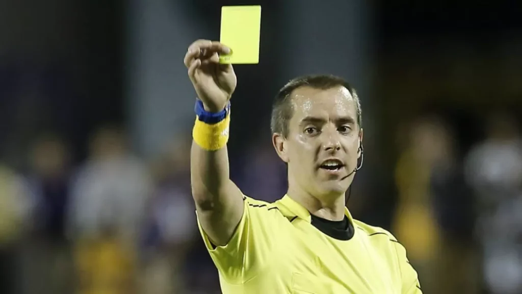 referee following the 17 rules of soccer