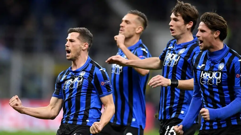 Atalanta playing in champions league and celebrating a goal