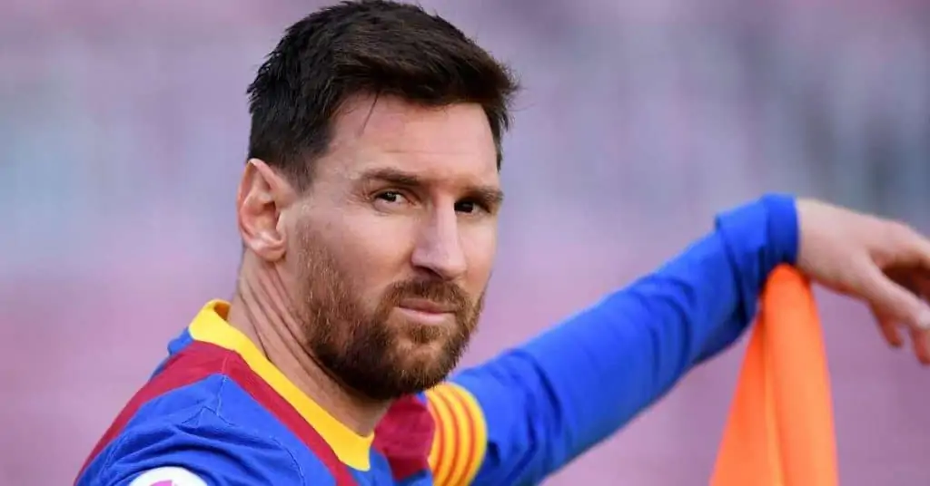 leo messi looking at the camera and leaning on a corner flag