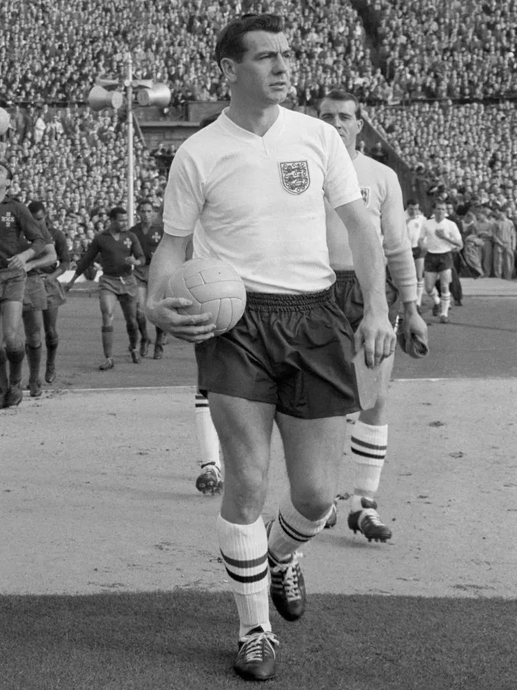 Johnny Haynes leading out an England team