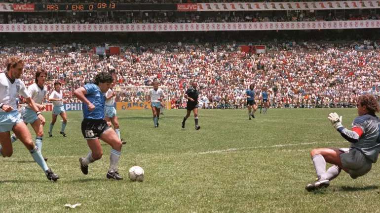 Diego Maradona about to score against peter shilton in 1986