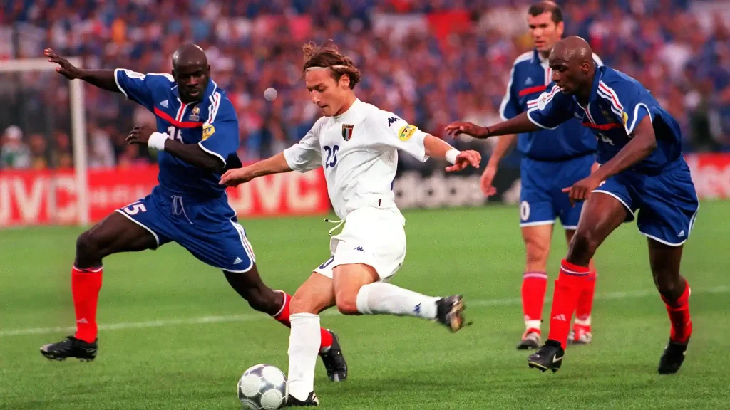 three french defenders trying to stop italian attacker in euro 2000 final