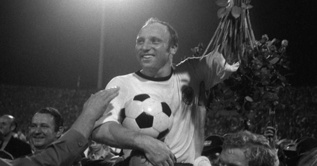 uwe seeler being carried off the soccer field