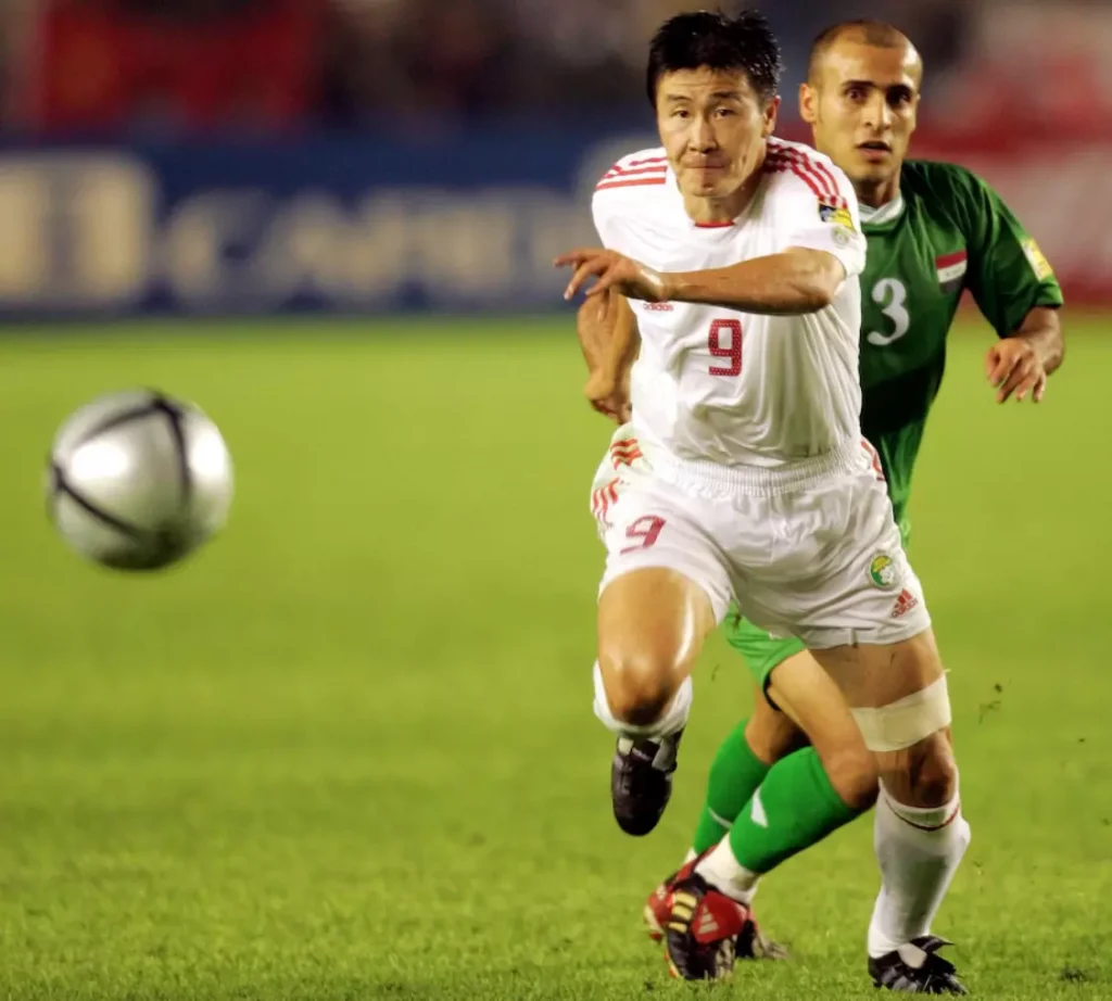 Hao Haidong chasing a soccer ball