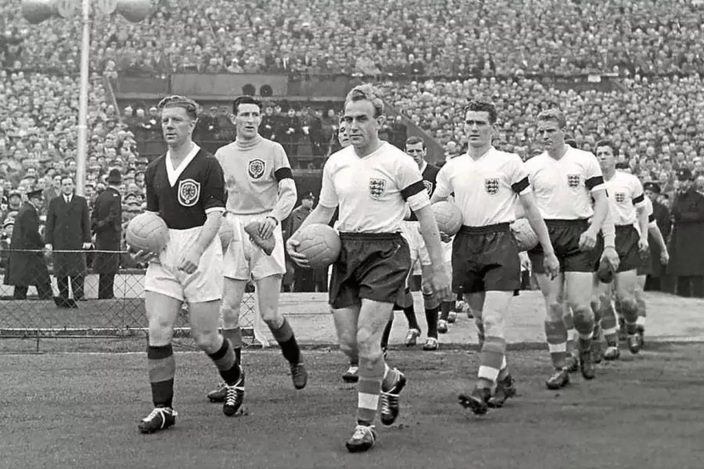 billy wright leading the england team out in wembley