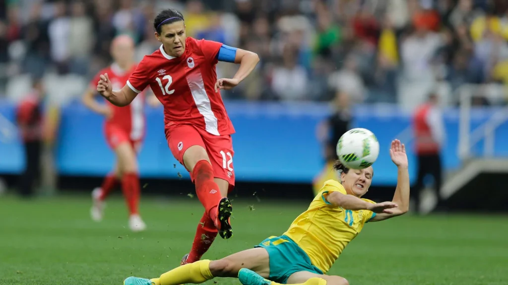 christrine sinclair being challenged by australian defender