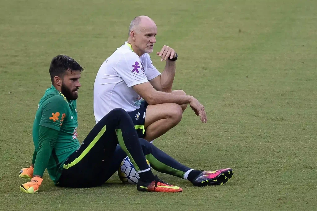 goalkeeping coach taffarel passing on a few words of encouragment to Alison Becker