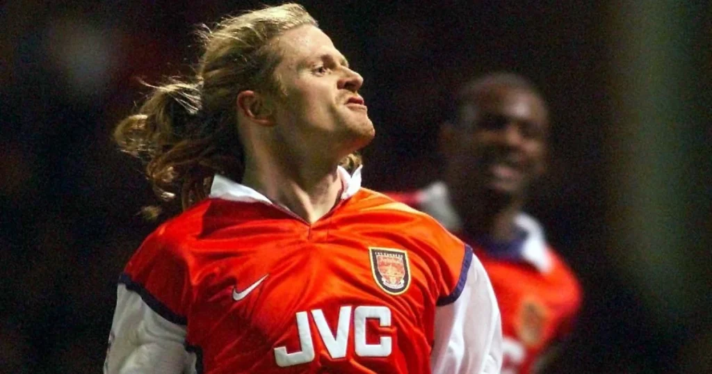 French midfielder Petit celebrating scoring a goal for arsenal