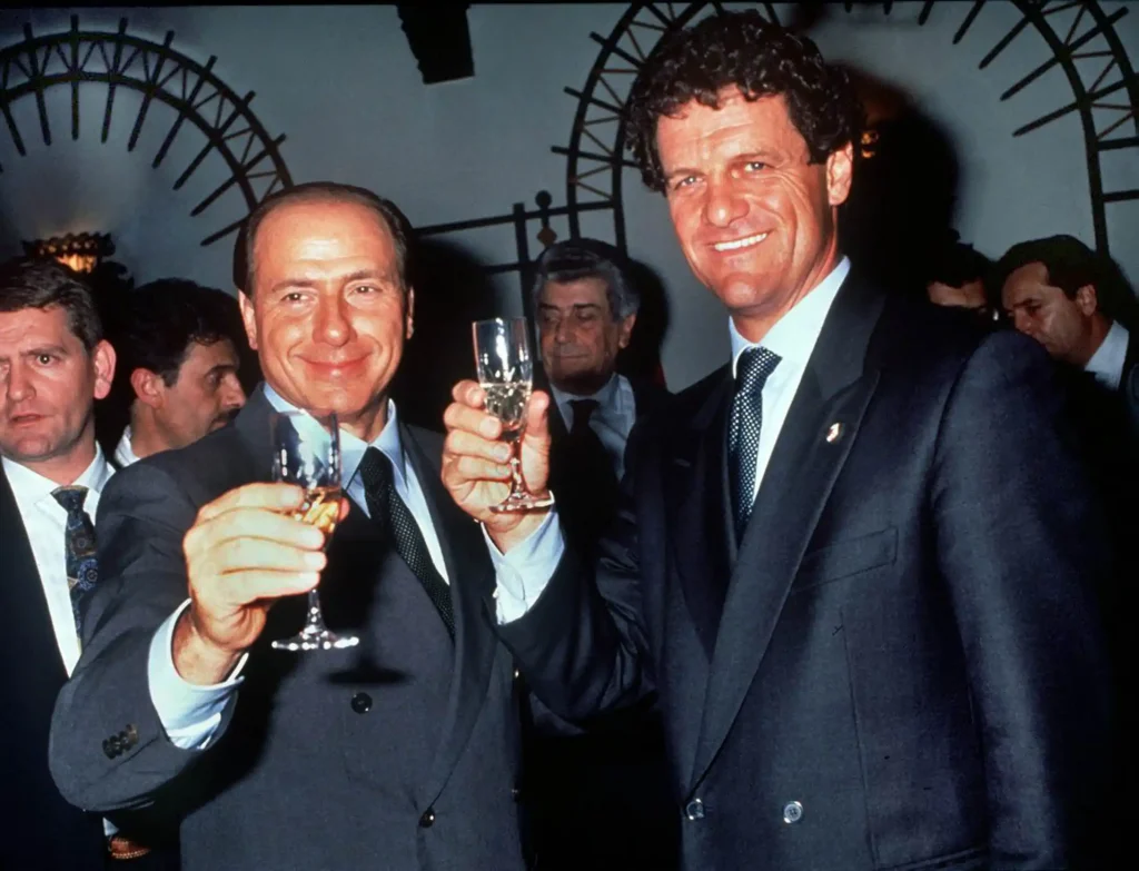 fabio capello and silvio berlusconi raise a toast