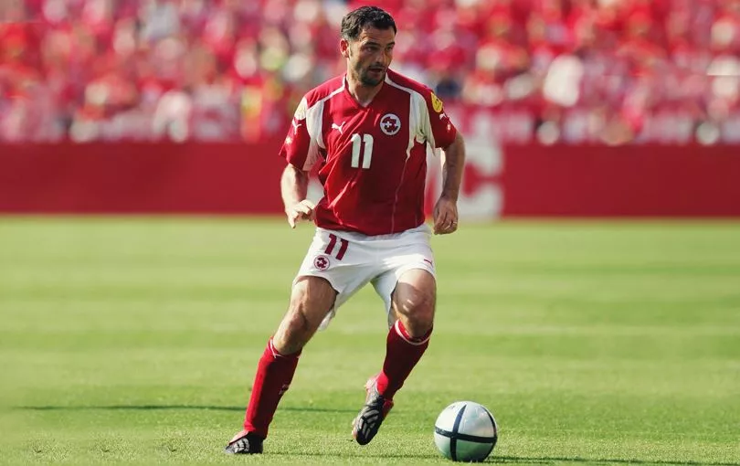 Stephane Chapuisat running with the ball for Switzerland