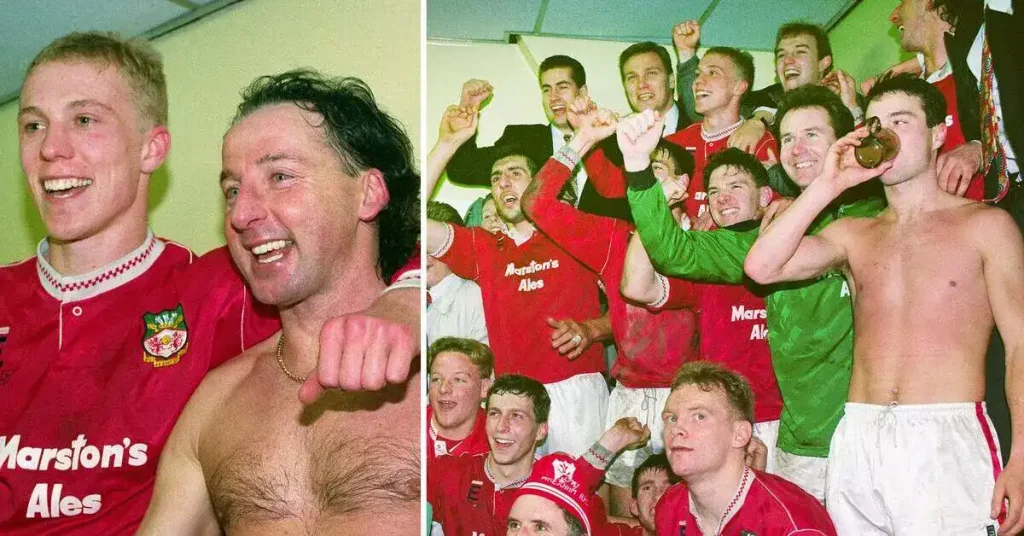 the team celebrates after Wrexham beating Arsenal in FA Cup