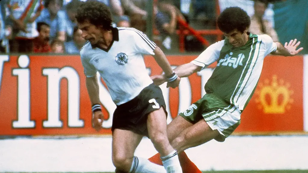 paul breitner defending the ball away from the opponent