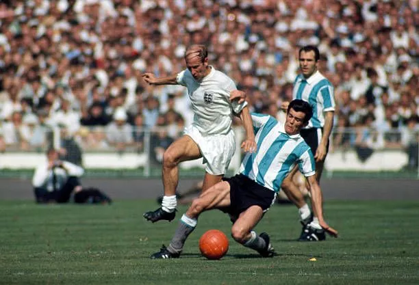 Bobby Charlton being tackled by Argentine player