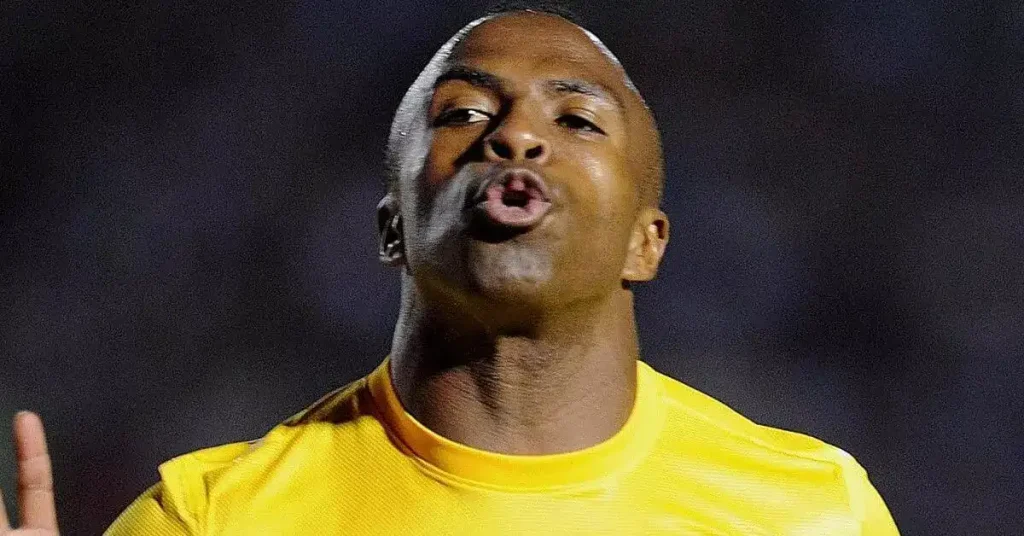 Christian Benitez making a facial expression of going close in scoring a goal