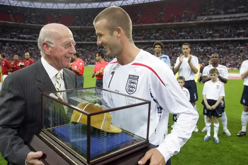 David Beckham won his 100th cap and presented by sir bobby charlton