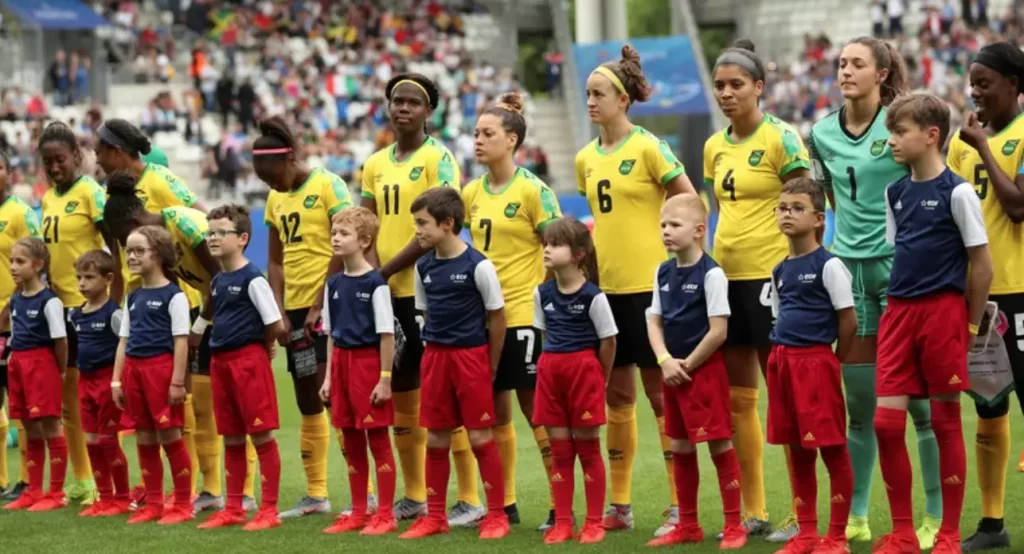 Jamaica Women's Soccer Team standing together for the national anthem
