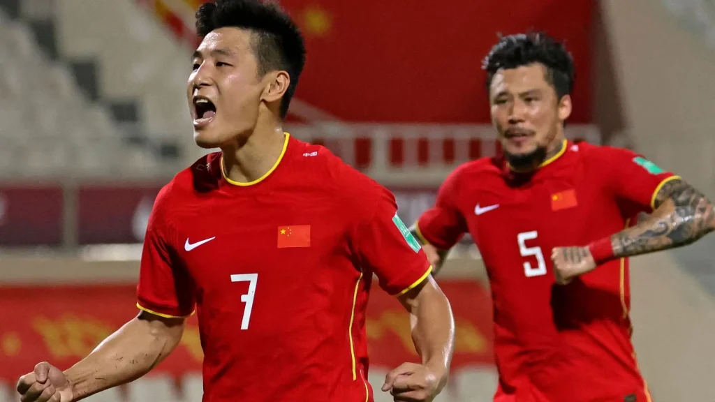 chinese national soccer player wu lei celebrating a goal