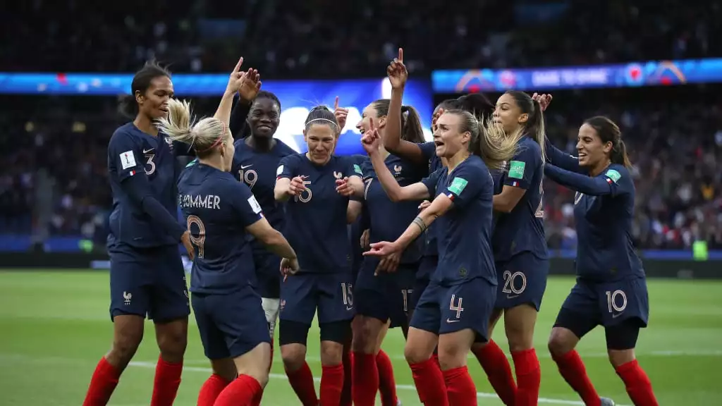 france women's soccer team celebrating a win