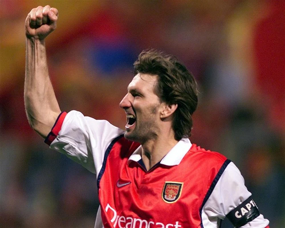 tony adams of arsenal punches the air with his right fist