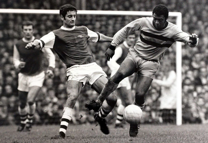 west ham john charles being tackled by arsenal opponent