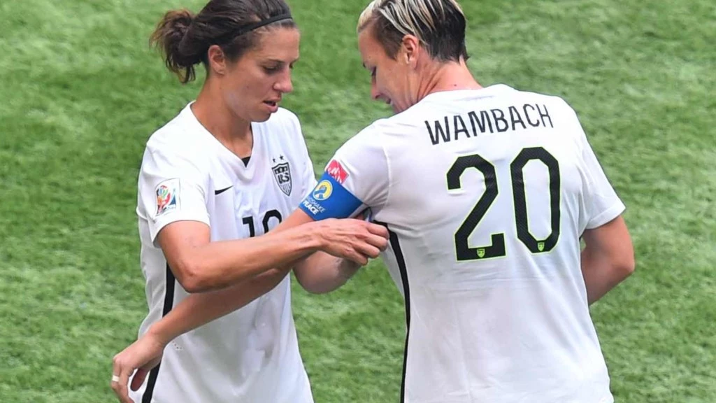 carli lloyd and abby wambach swapping captain armband