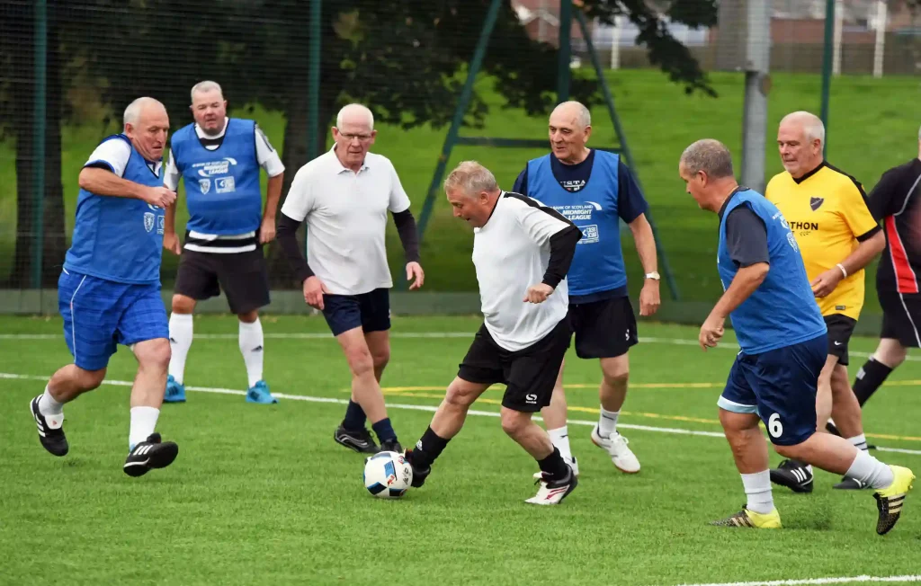 teams play a game of walking football