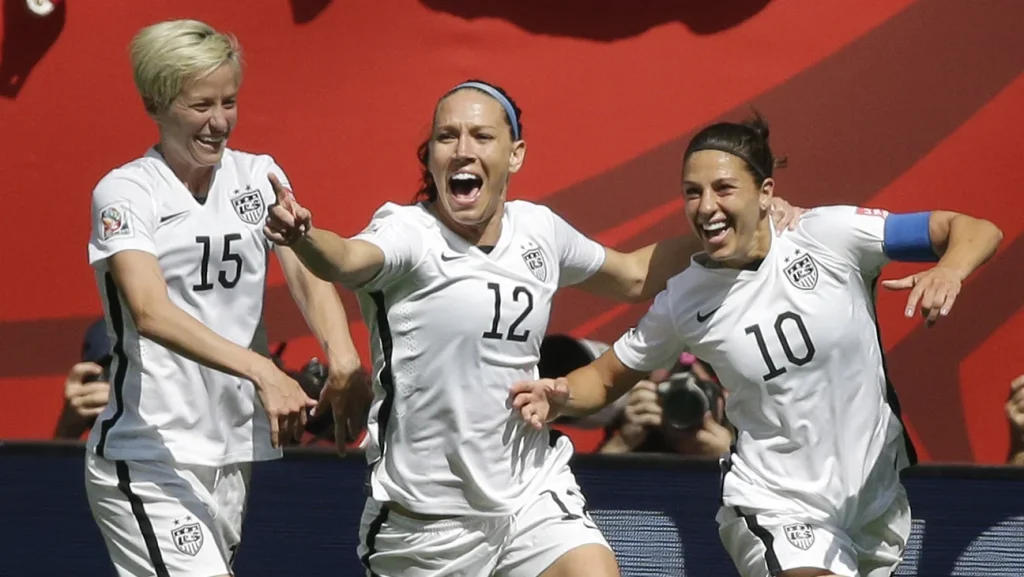 uswnt players celebrate after a goal