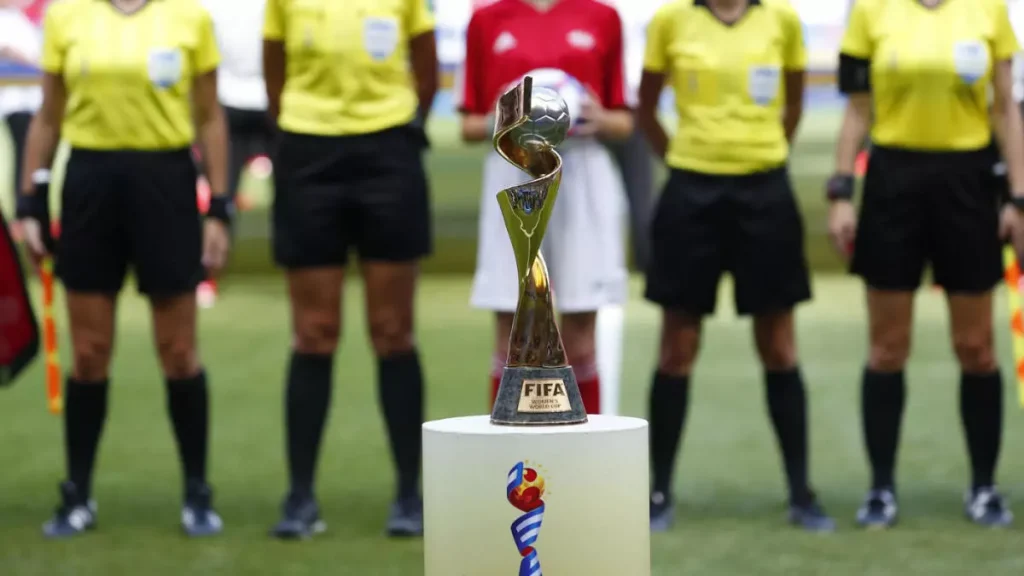 referees with the women's world cup trophy