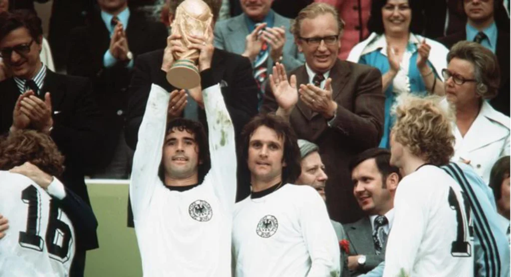 1974 world cup trophy being lifted by west germany players