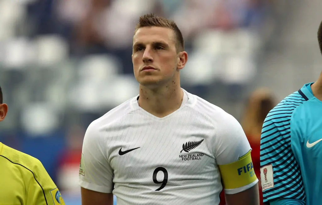Chris Wood new zealand soccer player listening to the national anthem