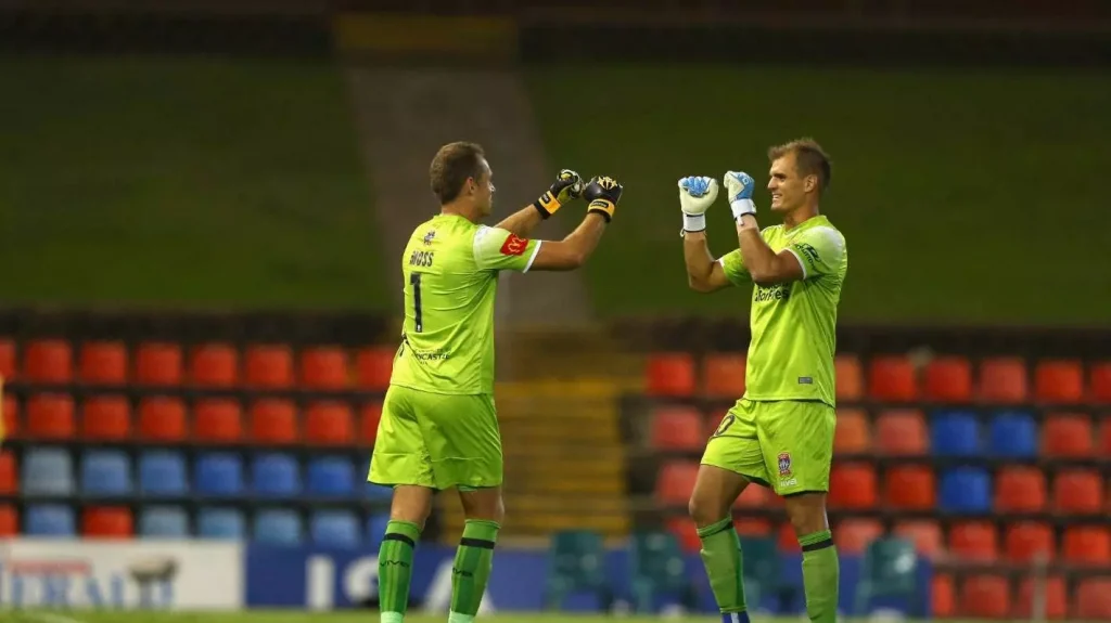 chris moss new zealand goalkeeper celebrating with another keeper