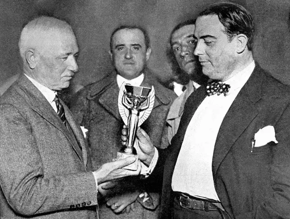 Jules Rimet Holding the World cup trophy named after him