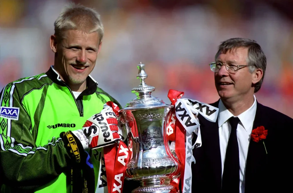 manchester united captain peter schmeichel with fa cup and sir alex ferguson