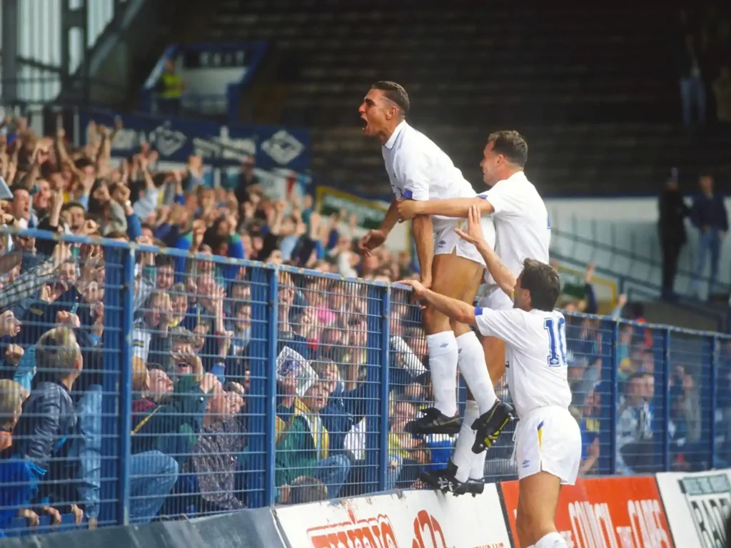 leeds players celebrating with the fans