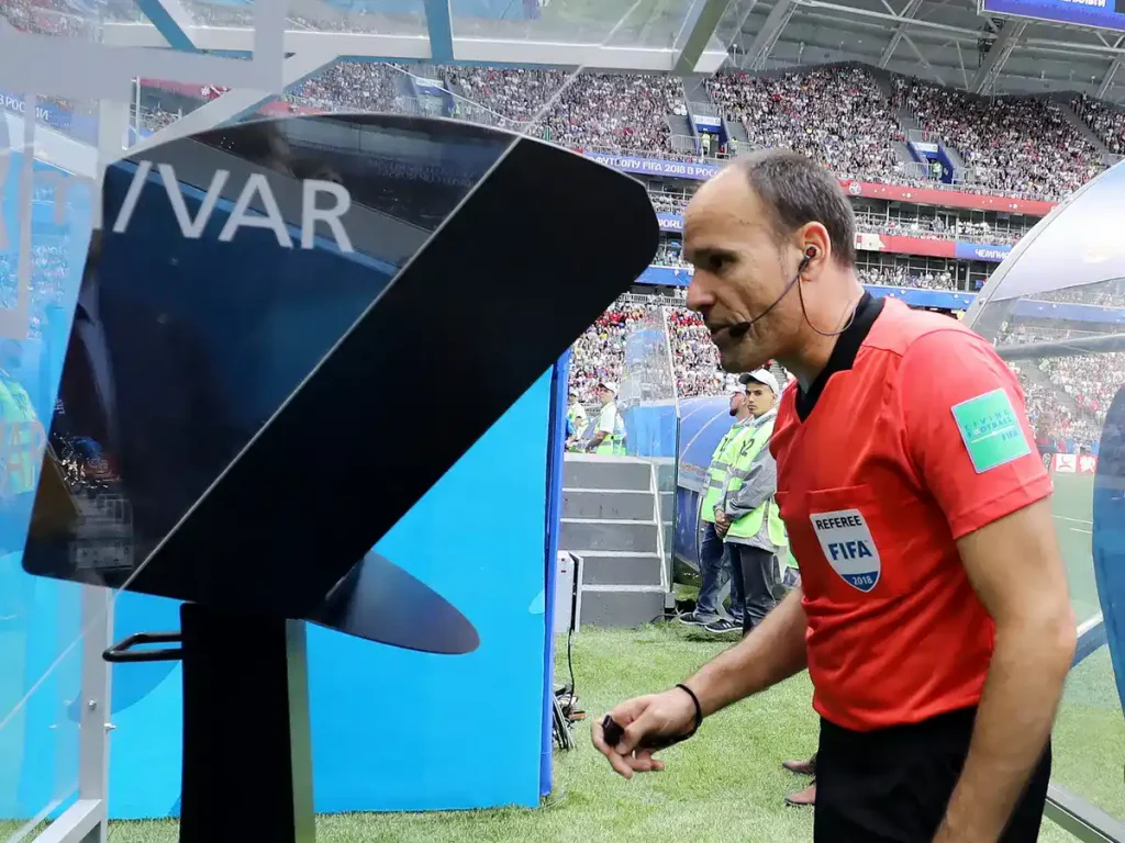 referee using VAR at world cup