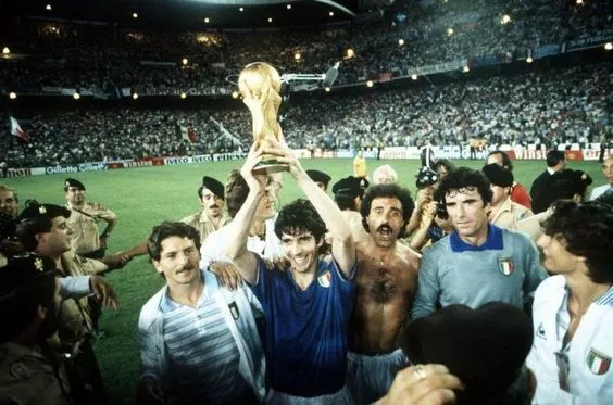 Paolo Rossi raising the 1982 world cup trophy above his head