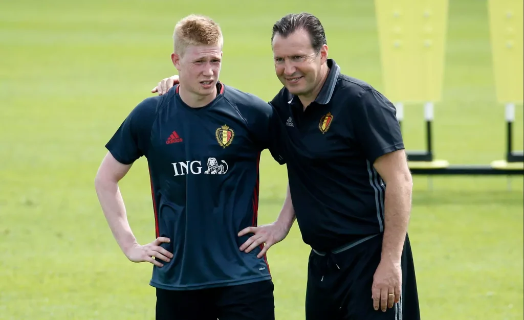 kevin de bruyne is being spoken to from manager marc wilmots
