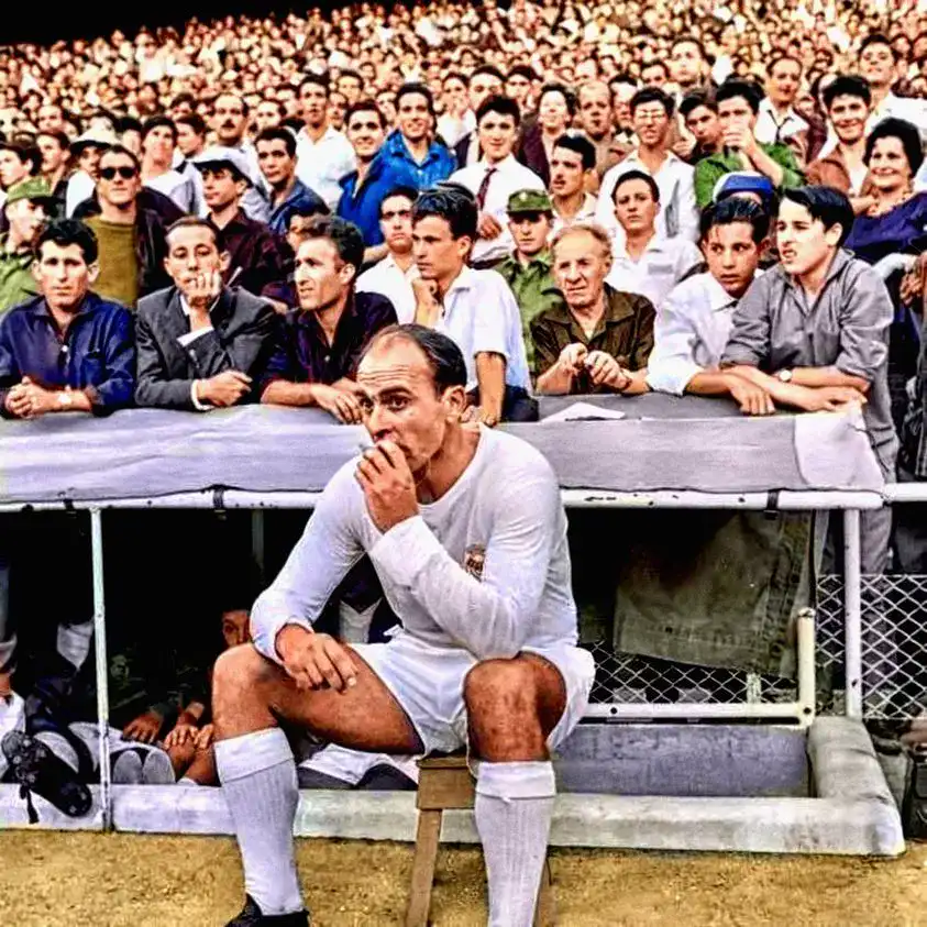 Alfredo Di Stefano smoking a cigarette on Real Madrid_s bench in 1964.