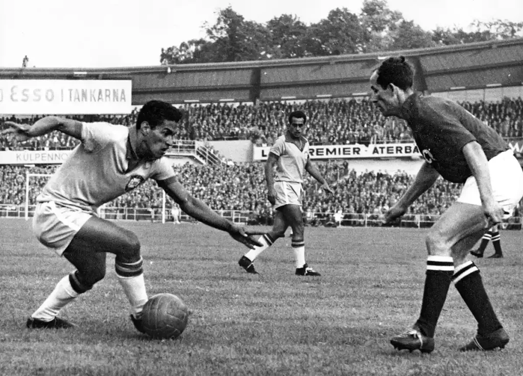 Brazil_s Garrincha, dribbles to past an unidentified Soviet Union player