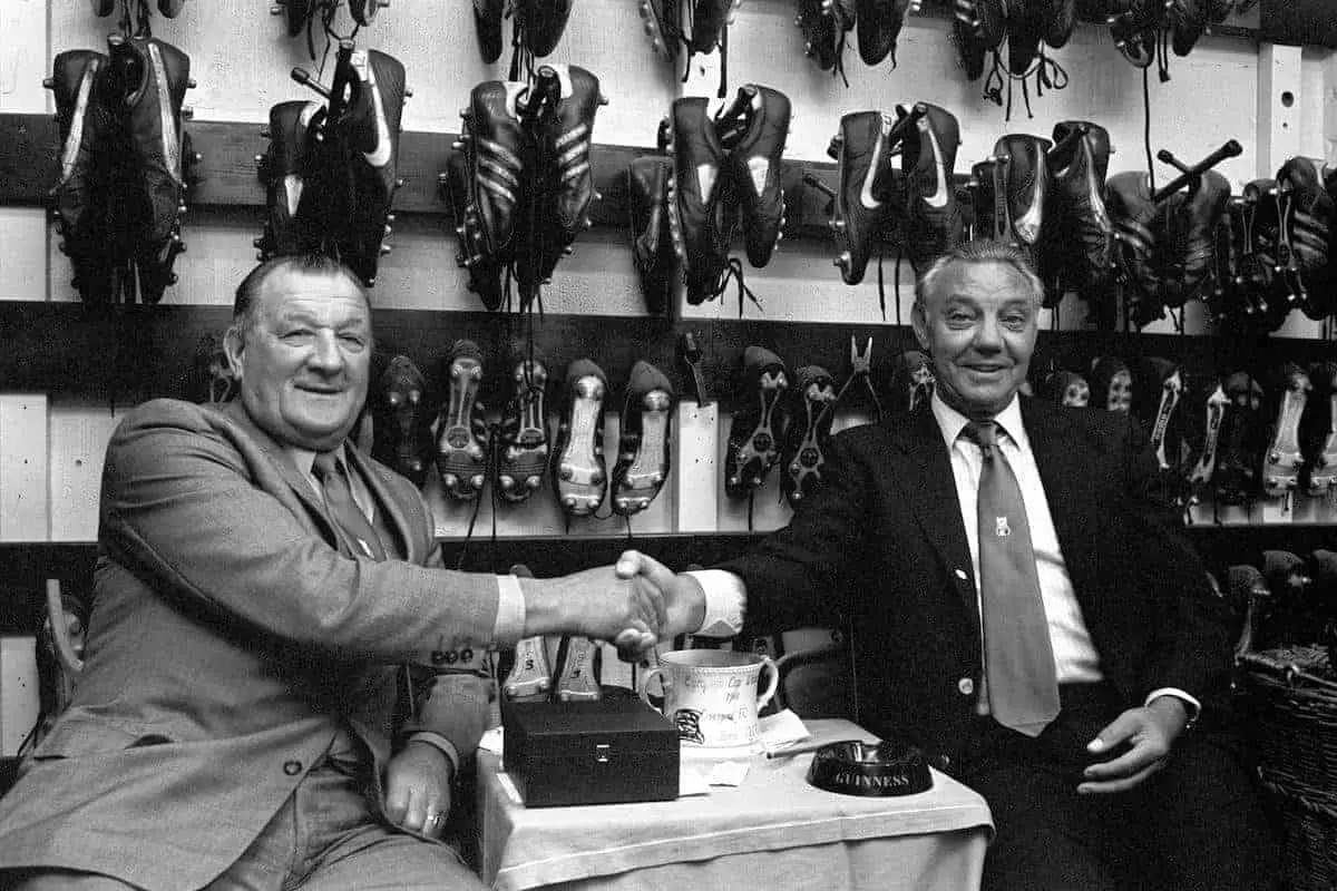 Bob Paisley sitting in Liverpool boot room