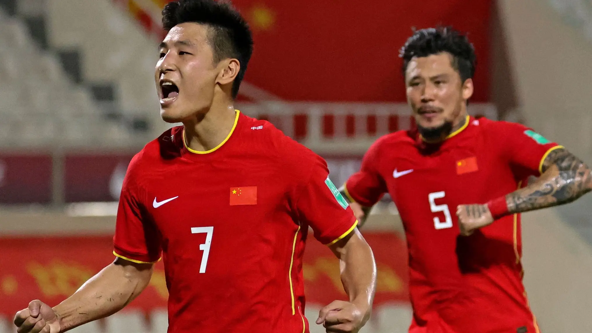 chinese national soccer player wu lei celebrating a goal