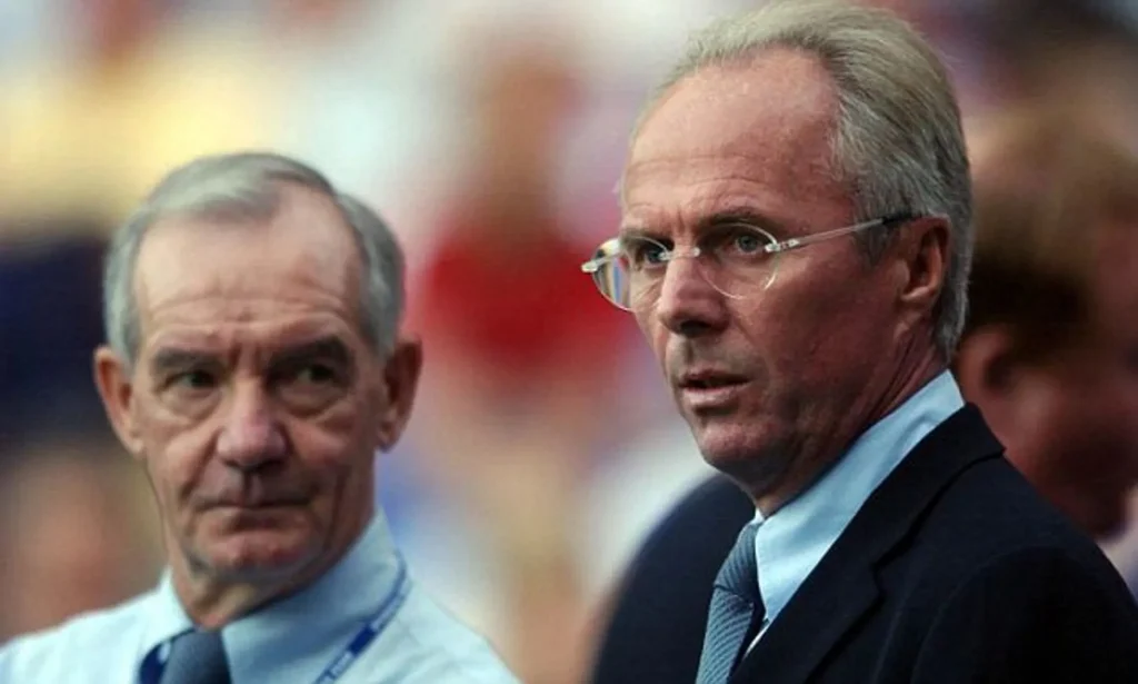 sven goran eriksson with his assistant grip behind him